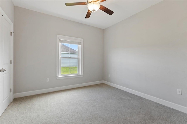 carpeted empty room with ceiling fan