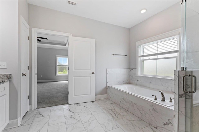 bathroom featuring vanity and plus walk in shower