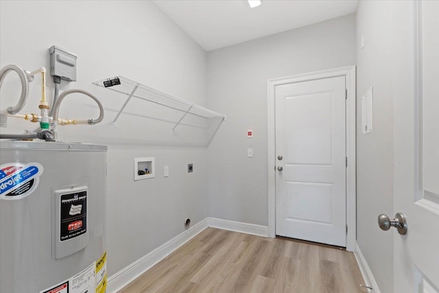 laundry area featuring washer hookup, water heater, hookup for an electric dryer, and light hardwood / wood-style flooring