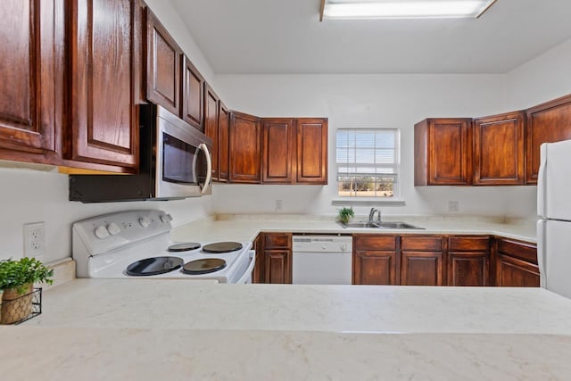 kitchen featuring sink and white appliances