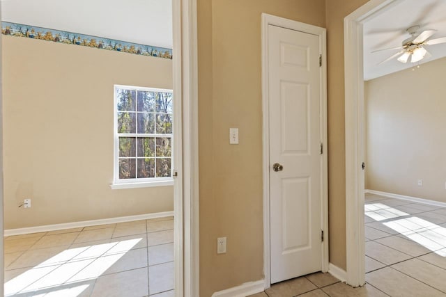 hallway with light tile patterned floors