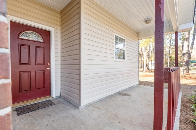 property entrance featuring covered porch