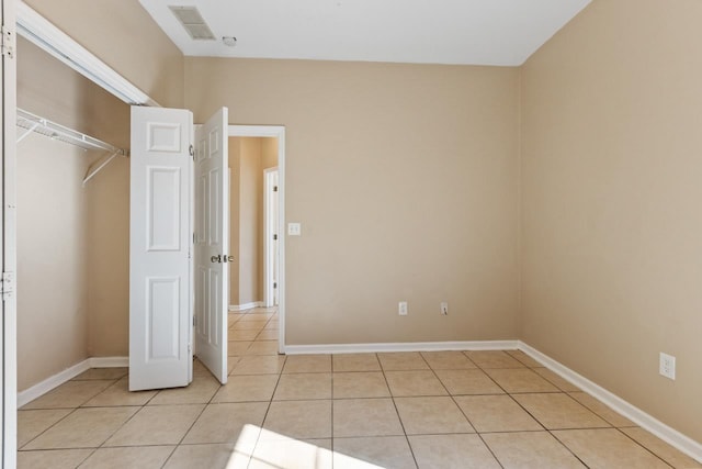 unfurnished bedroom featuring light tile patterned floors