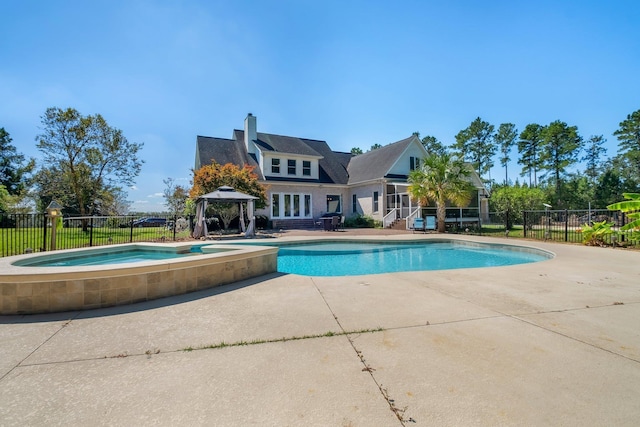 view of swimming pool with a fenced in pool, a gazebo, a patio area, fence, and an in ground hot tub