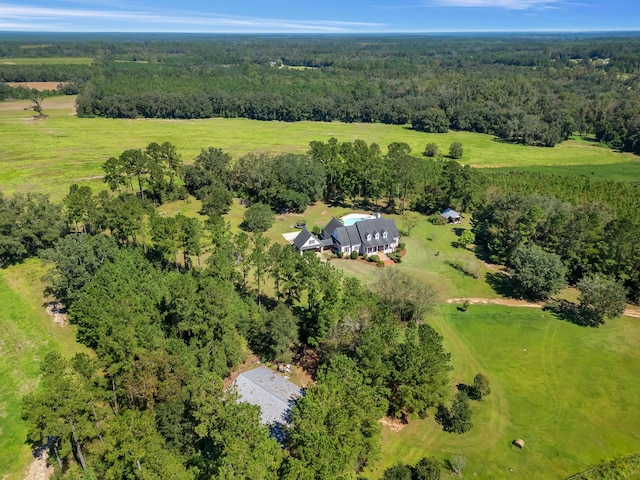 bird's eye view featuring a wooded view