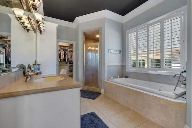 bathroom with ornamental molding, a walk in closet, tile patterned flooring, and a shower stall