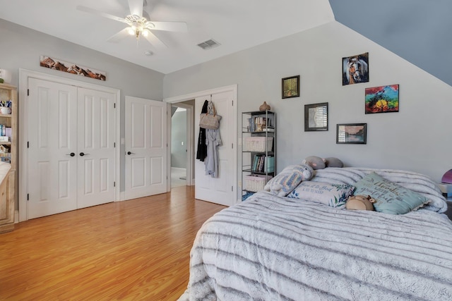 bedroom featuring visible vents, ceiling fan, and wood finished floors