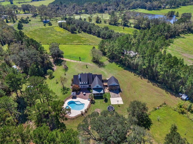 drone / aerial view featuring a water view and a rural view