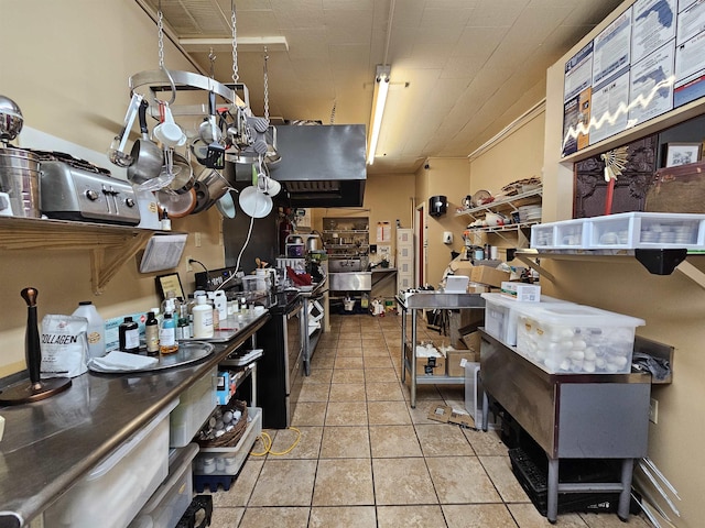 kitchen with light tile patterned flooring