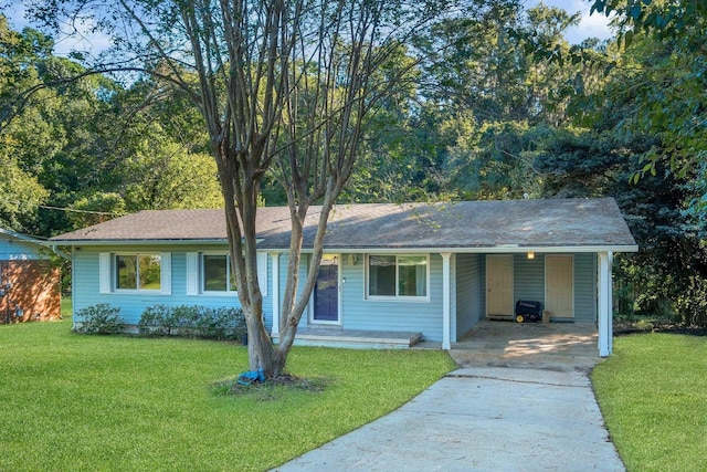 ranch-style home featuring a carport and a front yard