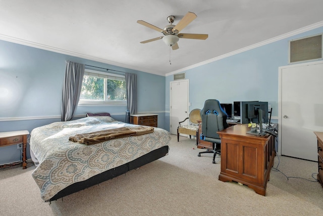 carpeted bedroom with ceiling fan and crown molding