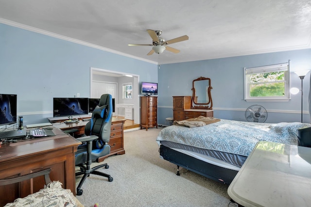 carpeted bedroom with ceiling fan and crown molding