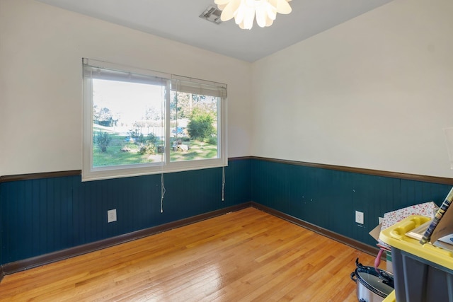 spare room with hardwood / wood-style floors