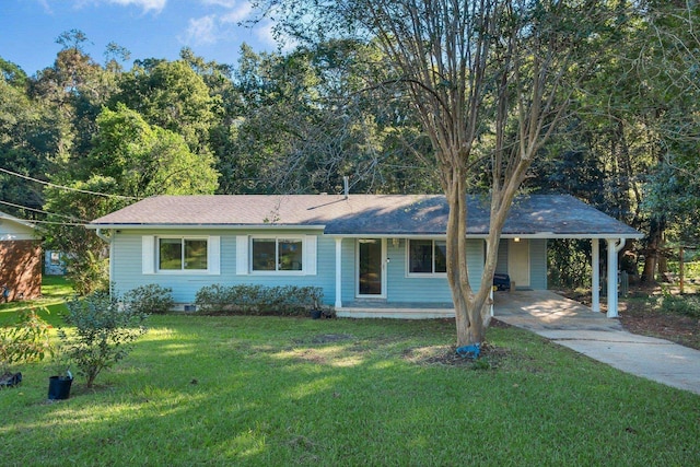 ranch-style house featuring a front yard and a carport