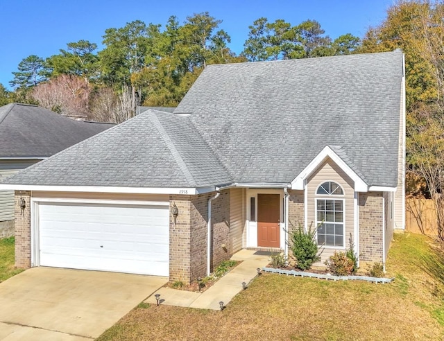 single story home with an attached garage, a front yard, concrete driveway, and brick siding