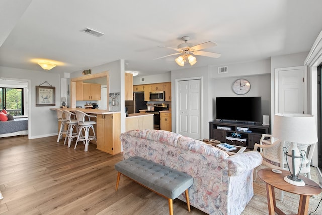 22 Lighthouse Pt, Crawfordville, FL 32327 - living area featuring light wood-style flooring and a ceiling fan