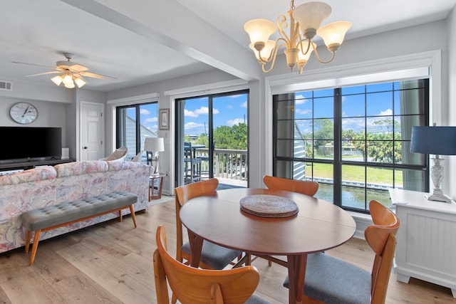 22 Lighthouse Pt, Crawfordville, FL 32327 - dining area featuring healthy amount of natural light, a chandelier, light wood-style flooring, and ceiling fan