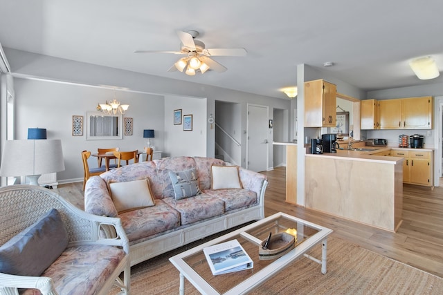 22 Lighthouse Pt, Crawfordville, FL 32327 - living area featuring light wood-style floors, a chandelier, and a ceiling fan