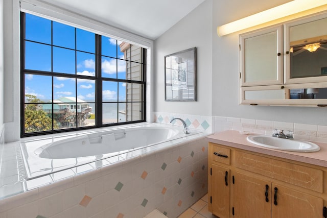 22 Lighthouse Pt, Crawfordville, FL 32327 - full bath featuring a bath, vanity, and lofted ceiling