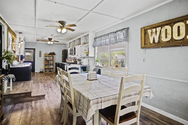 20158 NW Evans Ave, Blountstown, FL 32424 - dining area with wood finished floors, a ceiling fan, and baseboards