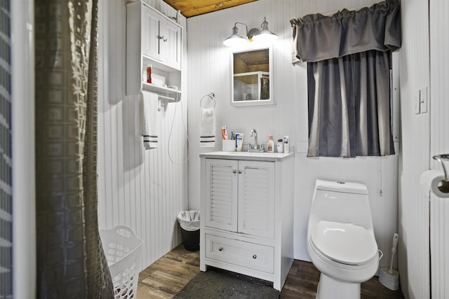 20158 NW Evans Ave, Blountstown, FL 32424 - full bathroom featuring vanity, toilet, a shower, and wood finished floors