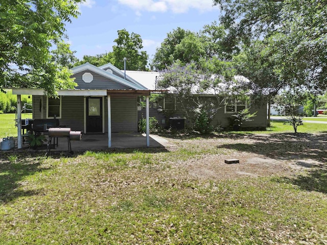 20158 NW Evans Ave, Blountstown, FL 32424 - view of green lawn featuring a patio area