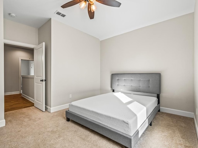 2288 Wabash Trl, Tallahassee, FL 32303 - carpeted bedroom with baseboards and a ceiling fan