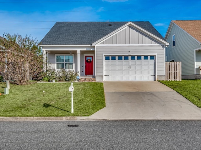 view of front of property with a garage and a front yard