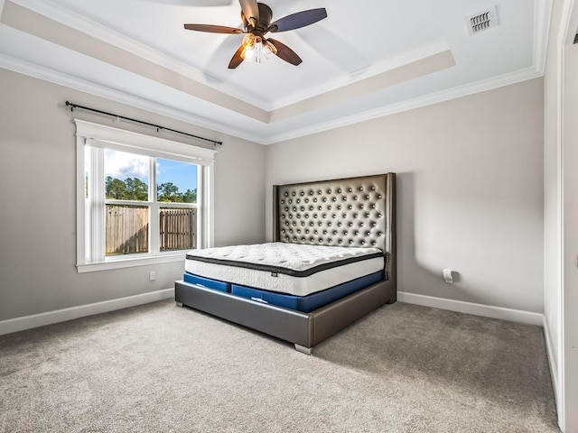 2288 Wabash Trl, Tallahassee, FL 32303 - bedroom with a tray ceiling, crown molding, carpet floors, and ceiling fan