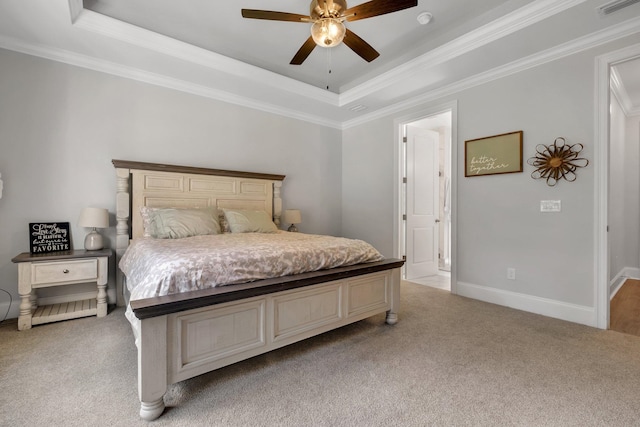 carpeted bedroom featuring ceiling fan, a raised ceiling, and crown molding