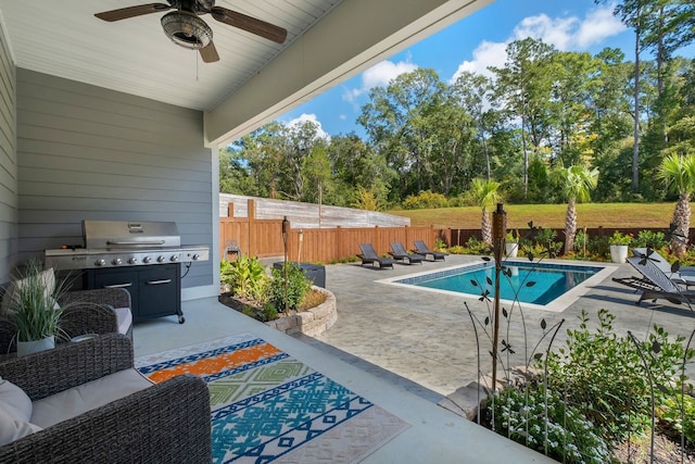 view of pool featuring ceiling fan, a patio, and grilling area