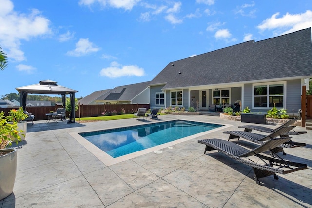 view of swimming pool featuring a gazebo and a patio