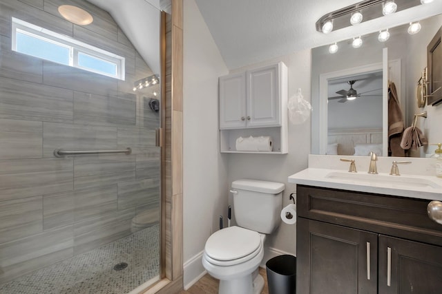 bathroom with walk in shower, vanity, lofted ceiling, and toilet