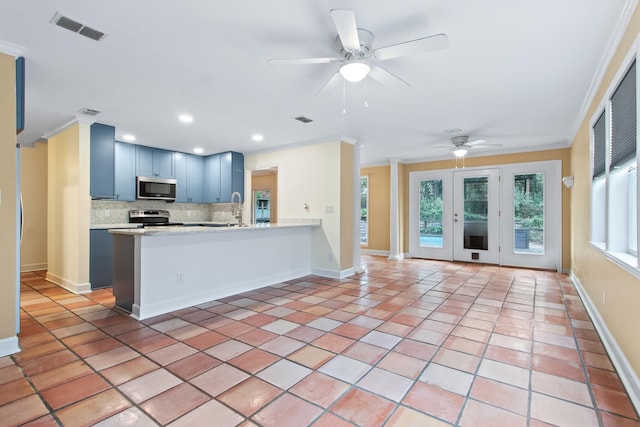 1753 Copperfield Cir, Tallahassee, FL 32312 - kitchen with stainless steel appliances, backsplash, ornamental molding, a ceiling fan, and light countertops