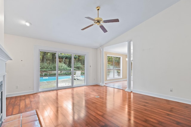 1753 Copperfield Cir, Tallahassee, FL 32312 - unfurnished living room with decorative columns, a fireplace, a ceiling fan, lofted ceiling, and hardwood / wood-style flooring