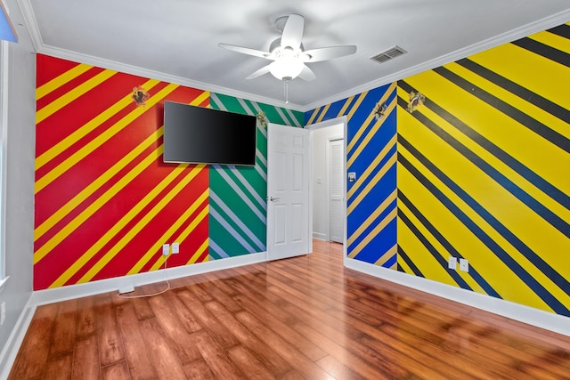 1753 Copperfield Cir, Tallahassee, FL 32312 - spare room with ornamental molding, a ceiling fan, wood finished floors, and wallpapered walls