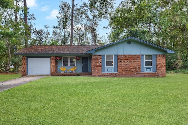 ranch-style house featuring a front yard and a garage