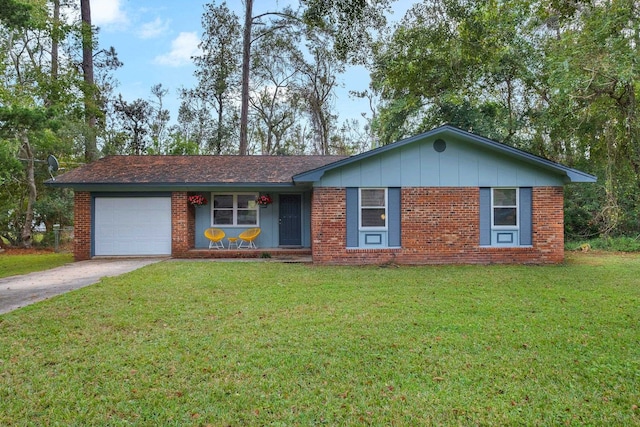 ranch-style house featuring a garage and a front lawn