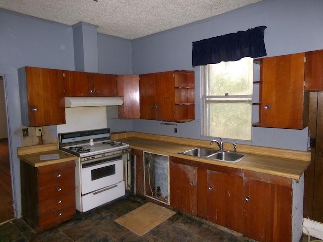 kitchen featuring sink, white range with gas stovetop, and a textured ceiling