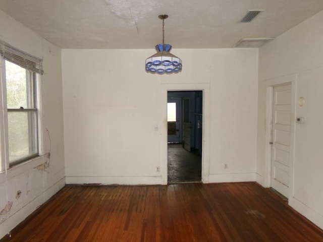 spare room with dark hardwood / wood-style floors