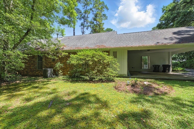 711 Kenilworth Rd, Tallahassee, FL 32312 - back of house featuring a lawn and roof with shingles