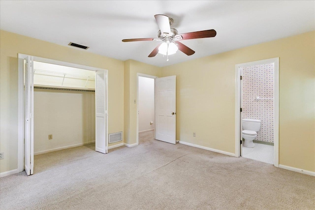 711 Kenilworth Rd, Tallahassee, FL 32312 - unfurnished bedroom with carpet flooring, ensuite bathroom, a closet, and a ceiling fan