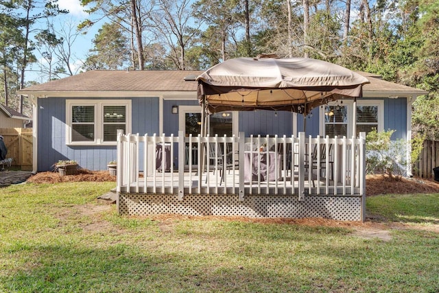 back of house with a wooden deck, a yard, and a gazebo