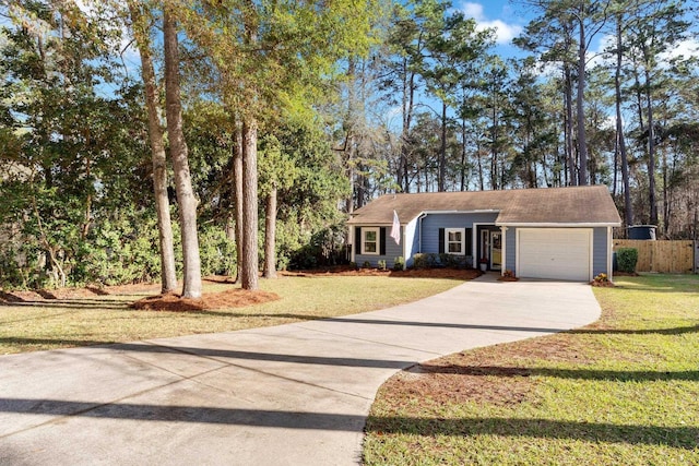 ranch-style home with a garage and a front lawn