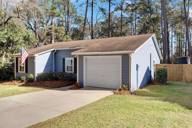 exterior space featuring a garage and a front yard