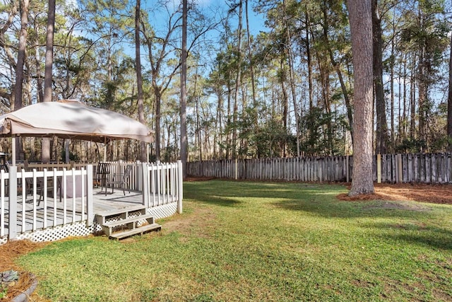 view of yard featuring a gazebo and a wooden deck