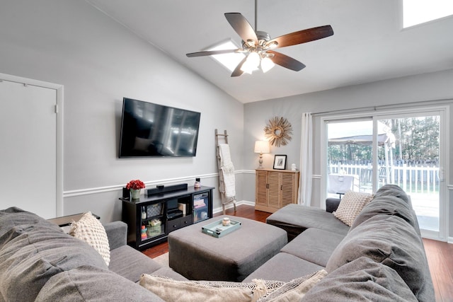 living room featuring ceiling fan, vaulted ceiling, and hardwood / wood-style floors