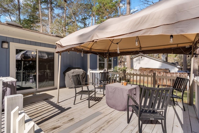 wooden deck featuring a gazebo