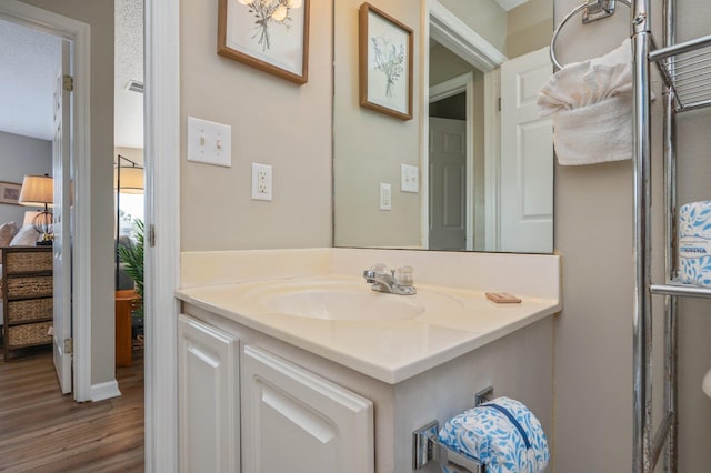 285 Payne Street 23B, Walton Beaches, FL 32550 - bathroom featuring wood finished floors and vanity