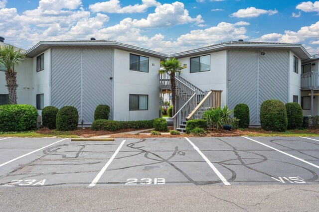 285 Payne Street 23B, Walton Beaches, FL 32550 - view of building exterior featuring uncovered parking and stairway